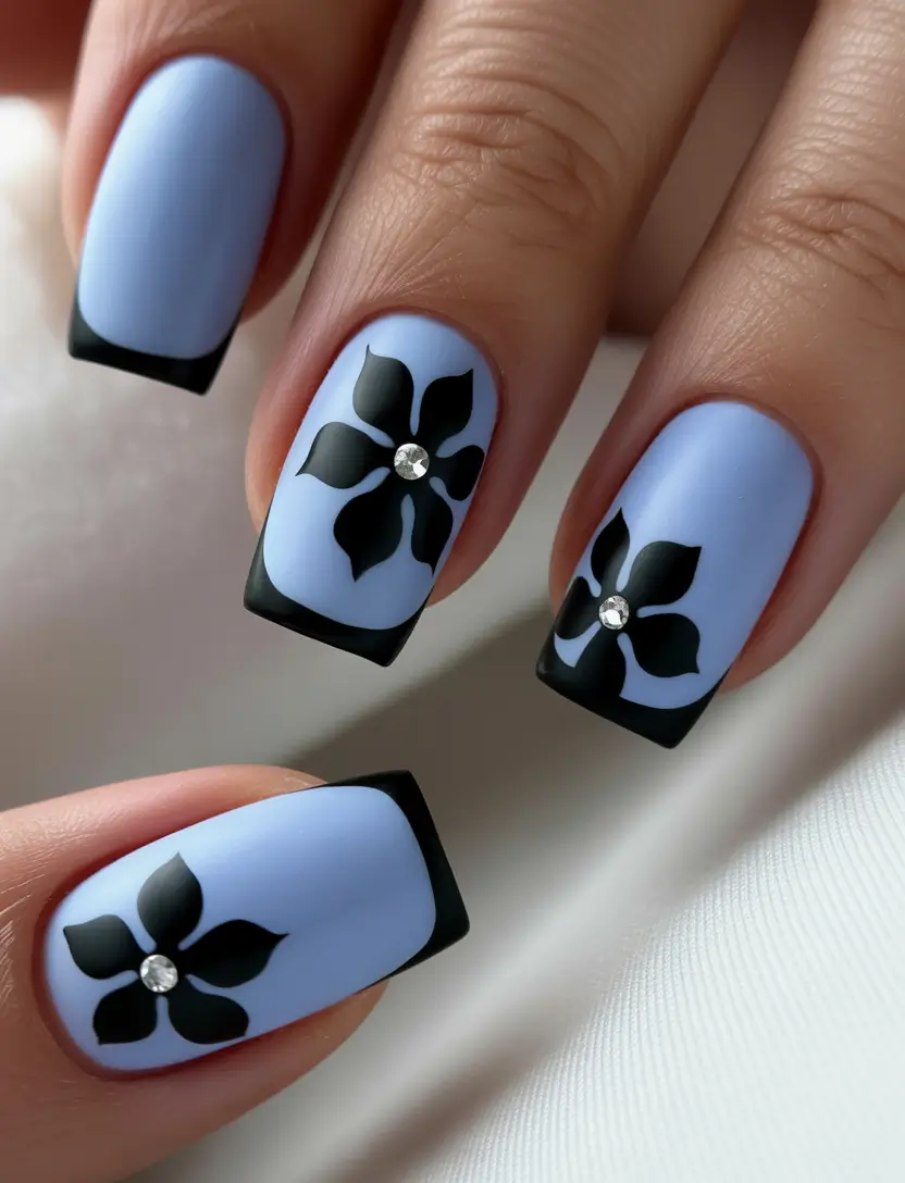spring nail design Powder Blue and Black Floral Contrast for a Modern Twist