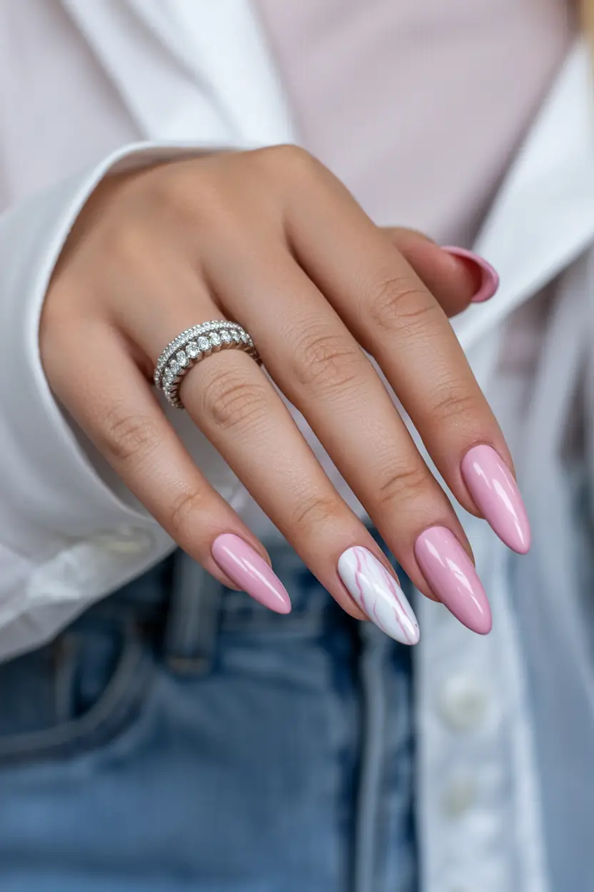 classy spring nails Glossy Almond Pink with a Soft Marble Accent