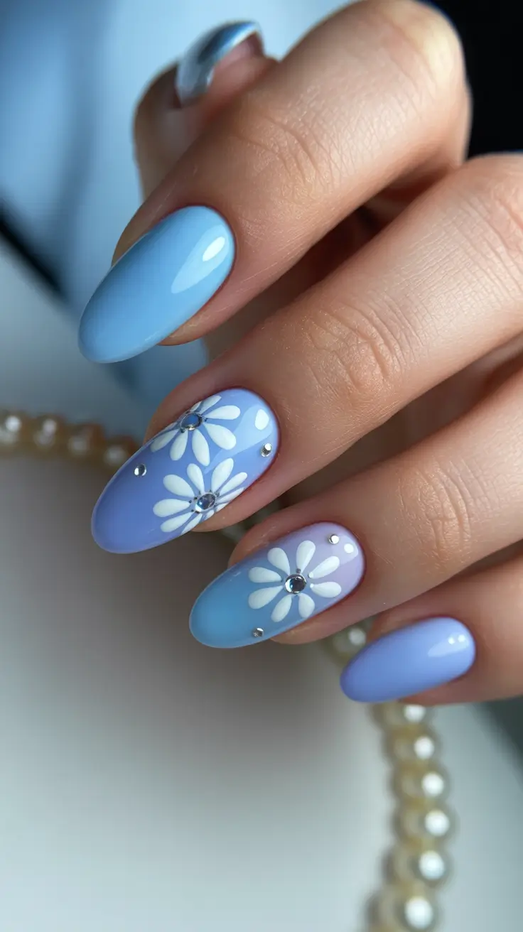 April nails color ideas 2026 Soft Blue Floral Almond Nails