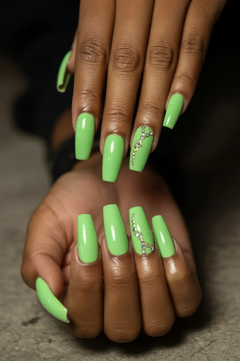 spring nails for brown skin Glossy Green Coffin Nails With Crystal Accent