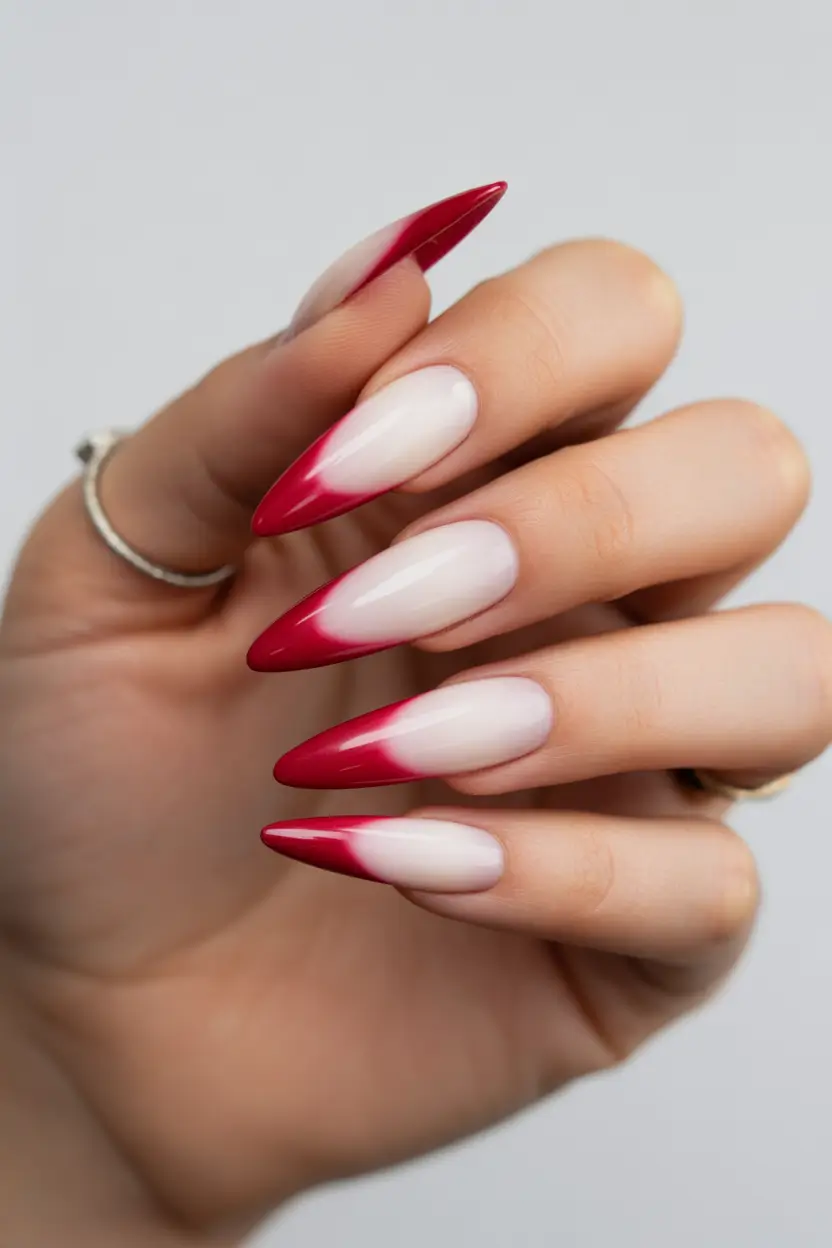spring to summer season nails ideas 2026 Sharp Red Ombre Stiletto Tips