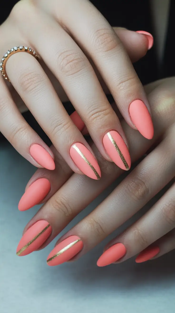 spring to summer season nails ideas 2026 Coral Matte Nails With Gold Accent Lines