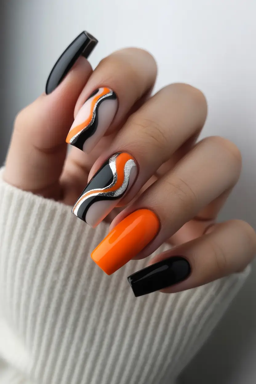 spring to summer season nails ideas 2026 Bold Orange And Black Graphic Waves
